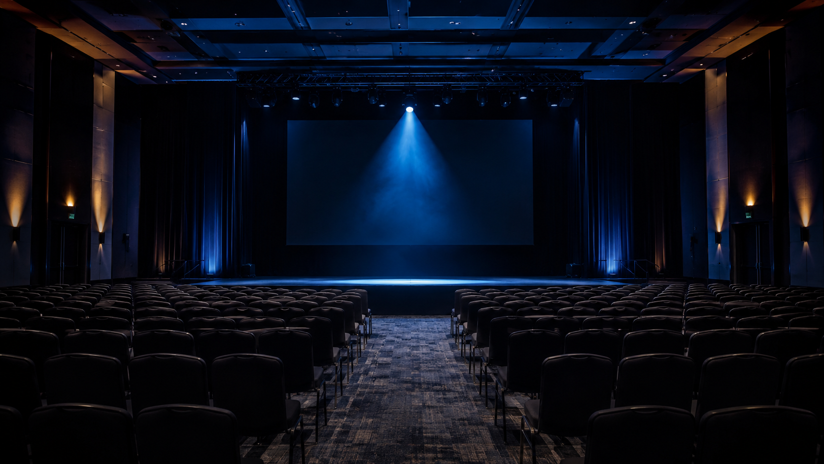 Empty enterprise conference stage. The room was built to impress. The demo never proved anything real.